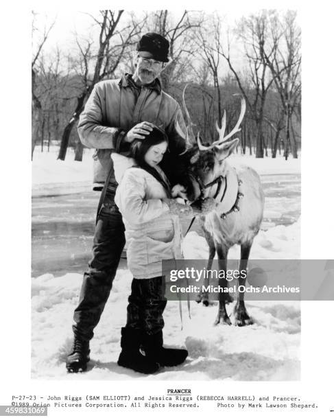 Actor Sam Elliott and actress Rebecca Harrell Tickell on the set of the movie "Prancer " , circa 1989.