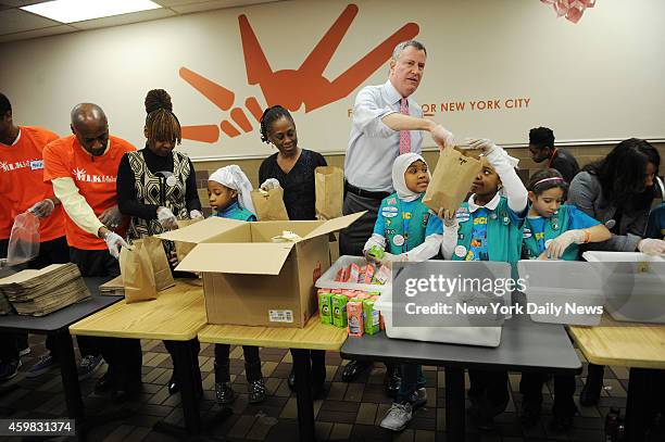 Mayor Bill de Blasio celebrates MLK, Jr. Day with First Lady Chirlane McCray at the Food Bank for NYC at the Distribution Community Kitchen of West...