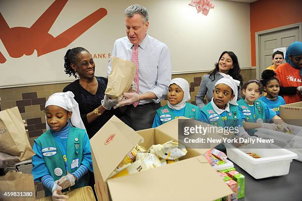 Mayor Bill de Blasio celebrates MLK, Jr. Day with First Lady Chirlane McCray at the Food Bank for NYC at the Distribution Community Kitchen of West...
