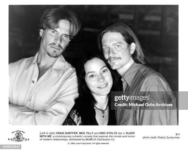 Actor Craig Sheffer, actress Meg Tilly and Eric Stoltz pose on set of the movie " Sleep with Me " , circa 1994.