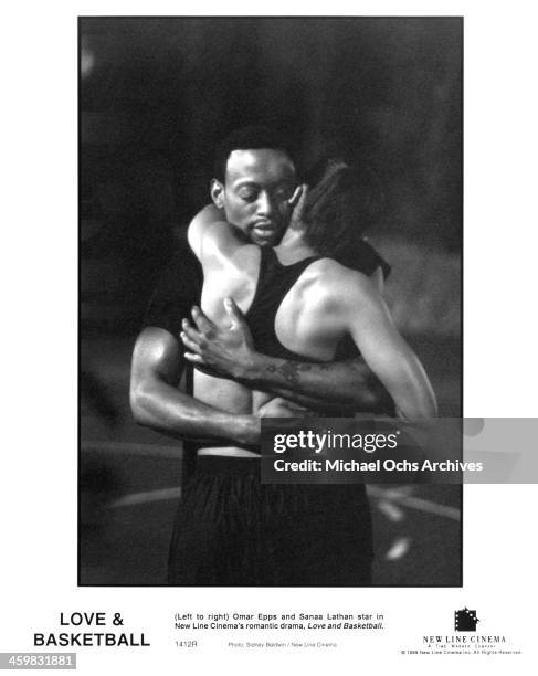 Actor Omar Epps and actress Sanaa Lathan on set of the New Line Cinema movie " Love & Basketball " , circa 2000.