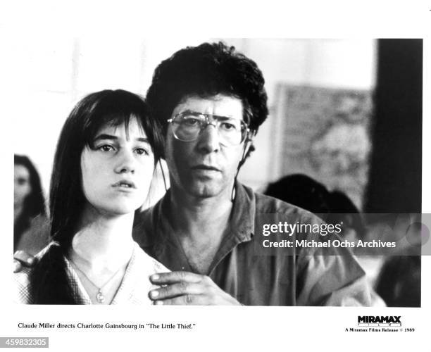 Director Claude Miller directs actress Charlotte Gainsbourg on the set of the Miramax films movie "The Little Thief " circa 1988.