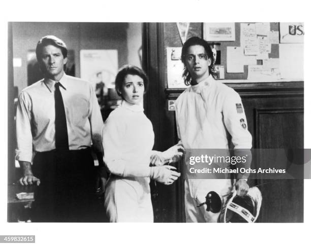 Actor Brett Cullen and actress Mia Sara and Christopher Rydell on set of the movie " By the Sword " , circa 1991.