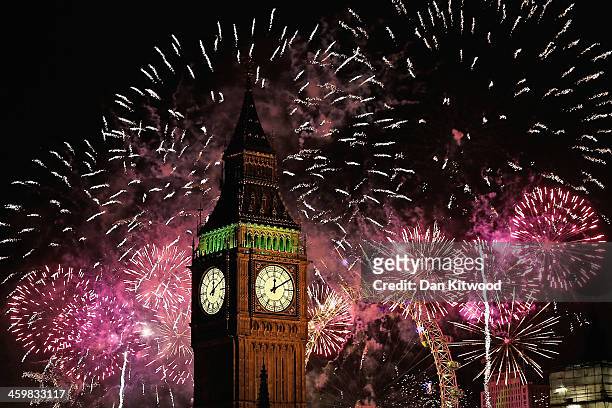 Fireworks light up the London skyline and Big Ben just after midnight on January 1, 2014 in London, England. Thousands of people lined the banks of...
