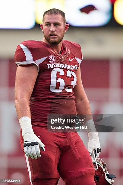 Dan Skipper of the Arkansas Razorbacks walks onto the field during a game against the Ole Miss Rebels at Razorback Stadium on November 22, 2014 in...