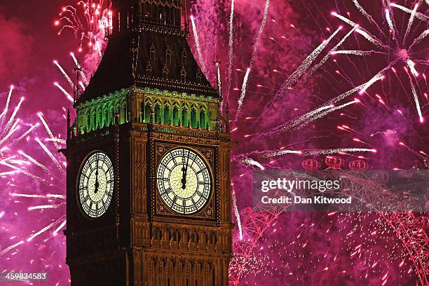 Fireworks light up the London skyline and Big Ben just after midnight on January 1, 2014 in London, England. Thousands of people lined the banks of...