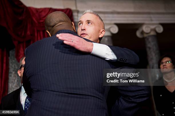 Rep. Trey Gowdy, R-S.C., right, hugs Sen. Tim Scott, R-S.C., after a mock swearing-in ceremony in the Capitol's Old Senate Chamber, December 2, 2014....