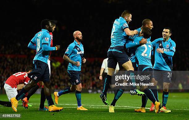 Steven Nzonzi of Stoke City celebrates scoring his team's first goal with his team-mates during the Barclays Premier League match between Manchester...