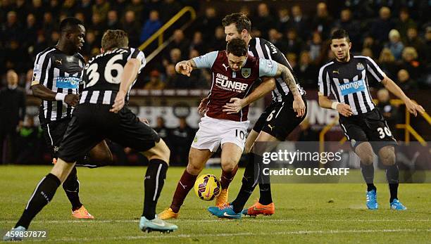 Newcastle United's English defender Mike Williamson vies with Burnley's English striker Danny Ings during the English Premier League football match...