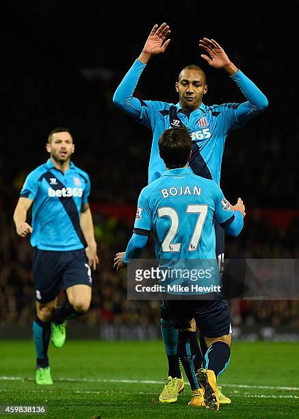 Steven Nzonzi of Stoke City celebrates scoring his team's first goal with his team-mates during the Barclays Premier League match between Manchester...