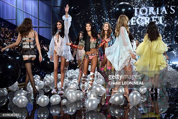 Models walk the runway during the 2014 Victoria's Secret Fashion Show at Earl's Court exhibition centre in London on December 2, 2014. AFP PHOTO /...
