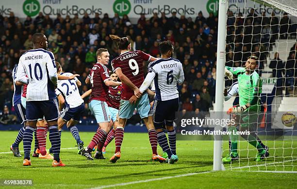 Goalkeeper Ben Foster of West Bromwich Albion looks on as James Tomkins of West Ham United scores their second goal during the Barclays Premier...