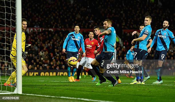 Stoke City Goalkeeper Asmir Begovic looks on as Juan Mata of Manchester United scores his team's second goal during the Barclays Premier League match...