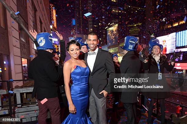 Kat Graham and finance Cottrell Guidry celebrate the New Year with NIVEA at the official Hard Rock Café party Times Square on December 31, 2013 in...
