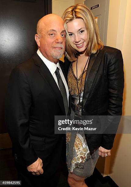 Billy Joel and Alexis Roderick pose backstage at the Billy Joel New Year's Eve Concert at the Barclays Center of Brooklyn on December 31, 2013 in New...