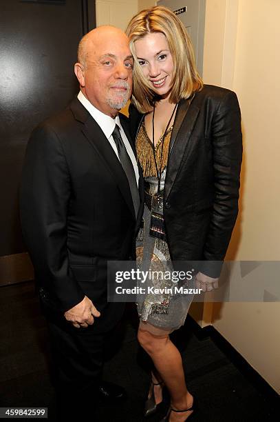 Billy Joel and Alexis Roderick pose backstage at the Billy Joel New Year's Eve Concert at the Barclays Center of Brooklyn on December 31, 2013 in New...