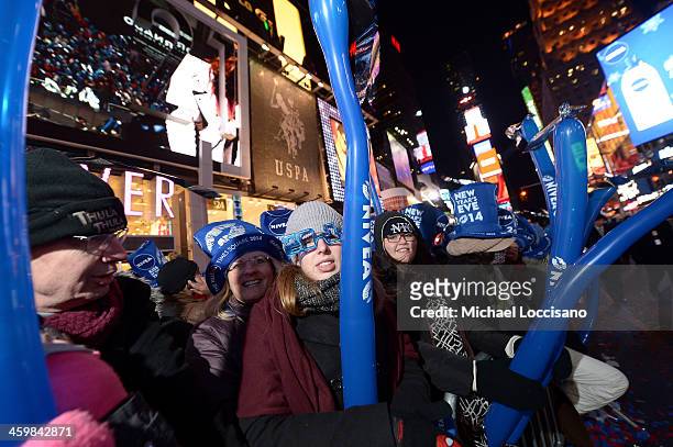 Millions celebrate New Years Eve with NIVEA hats in Times Square on December 31, 2013 in New York City.