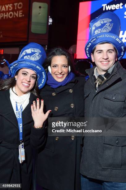 Zac Hihey surprises his girlfriend, Hannah Kanaan, with a proposal on the NIVEA Kiss Stage in Times Square on December 31, 2013 in New York City.