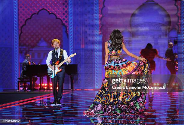 Ed Sheeran performs as models walk the runway at the annual Victoria's Secret fashion show at Earls Court on December 2, 2014 in London, England.