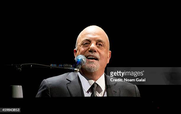 Billy Joel performs at Barclays Center on December 31, 2013 in New York City.