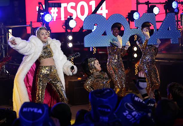 Miley Cyrus performs as thousands of revelers gather in New York's Times Square to celebrate the ball drop at the annual New Year's Eve celebration...