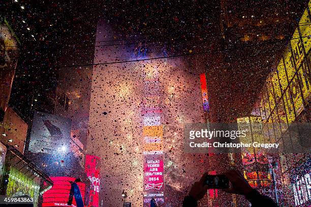 Confetti falls throughout Times Square during the New Years Eve celebration on January 1, 2013 in New York City. An estimated one million revelers...