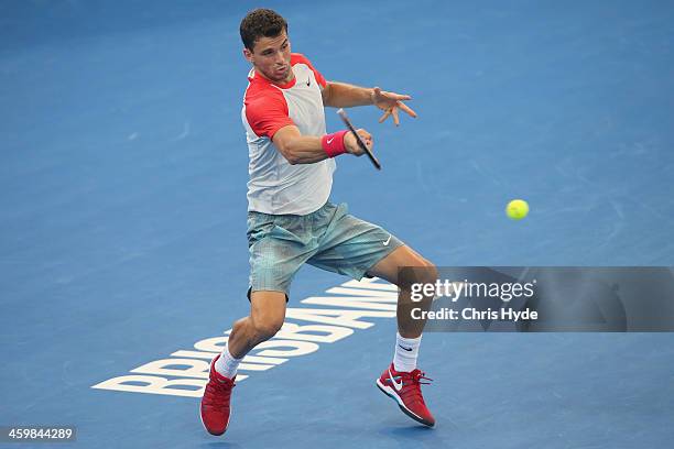 Grigor Dimitrov of Bulgaria plays a forehand in his match against Marin Cilic of Croatia during day four of the 2014 Brisbane International at...