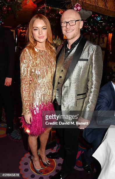 Lindsay Lohan and John Caudwell attend the Chopard Christmas Party at Annabel's on December 2, 2014 in London, England.