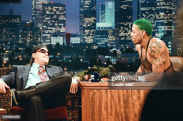 Episode 817 -- Pictured: Host Jay Leno and professiona; basketball player Dennis Rodman switch places during an interview on December 1, 1995 --