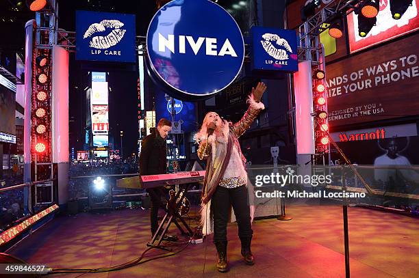 Singer Melissa Etheridge performs on the NIVEA Kiss Stage in Times Square on December 31, 2013 in New York City.