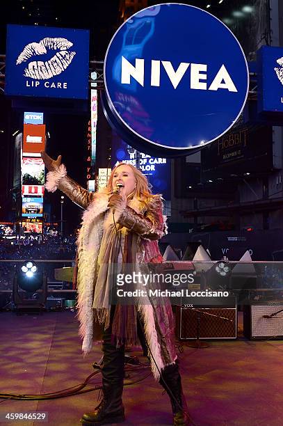 Singer Melissa Etheridge performs on the NIVEA Kiss Stage in Times Square on December 31, 2013 in New York City.