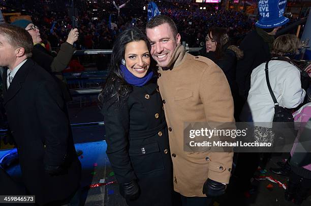 Couples ring in the New Year in NIVEA hats in in Times Square on December 31, 2013 in New York City.