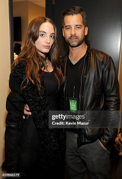 Alexa Ray Joel and Ryan Gleason pose backstage at the Billy Joel New Year's Eve Concert at the Barclays Center of Brooklyn on December 31, 2013 in...