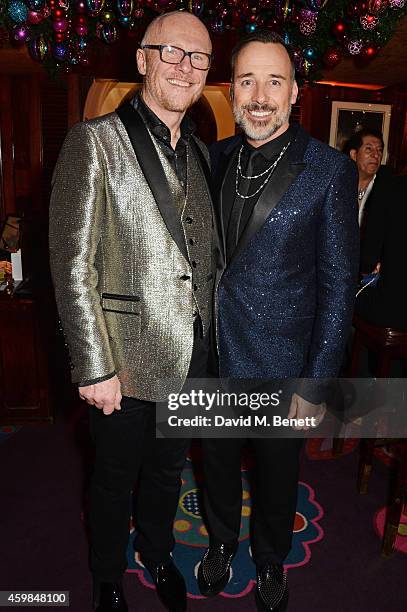 John Caudwell and David Furnish attend the Chopard Christmas Party at Annabel's on December 2, 2014 in London, England.