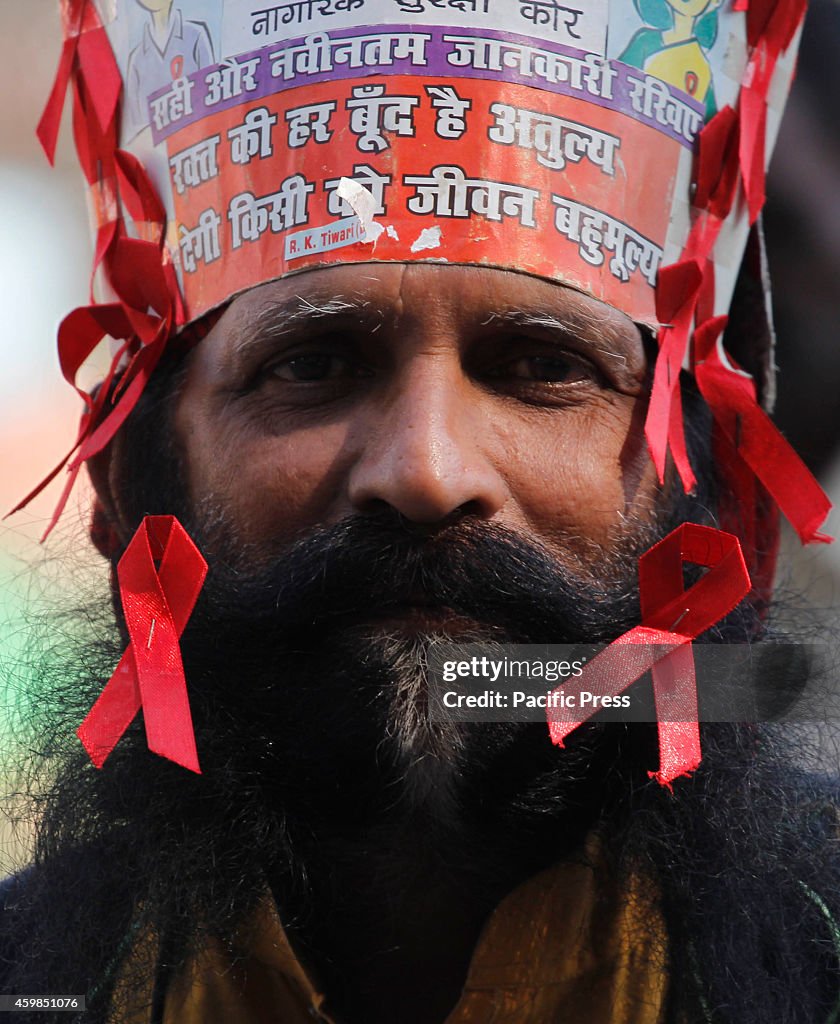 A social worker diplays red ribbon during the occasion of  "...