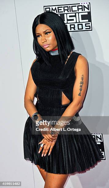 Singer Nicki Minaj arrives for the 42nd Annual American Music Awards held at Nokia Theatre L.A. Live on November 23, 2014 in Los Angeles, California.