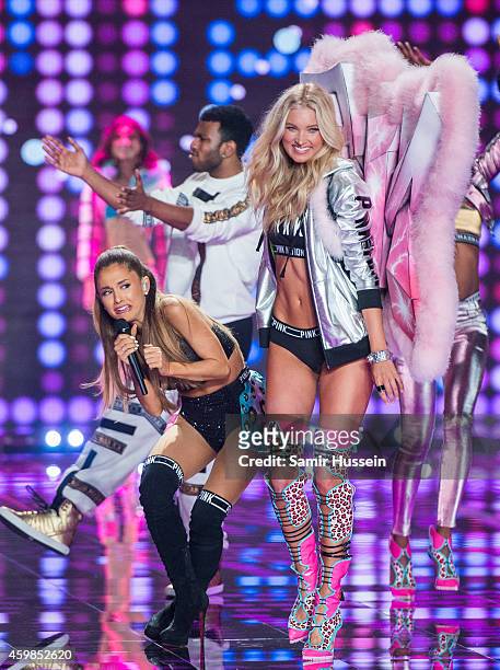 Ariana Grande performs as Elsa Hosk walks the runway at the annual Victoria's Secret fashion show at Earls Court on December 2, 2014 in London,...