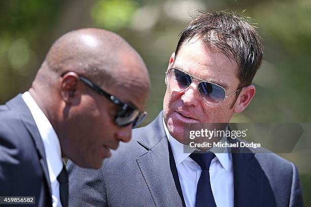 Australian cricket legend Shane Warne and West Indies cricket legend Brian Lara arrive during the Funeral Service for Phillip Hughes on December 3,...