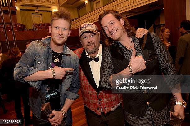 Brian Kelley of Florida Georgia Line, Larry the Cable Guy, and Tyler Hubbard of Florida Georgia Line attend the 2014 CMT Artists Of The Year at the...