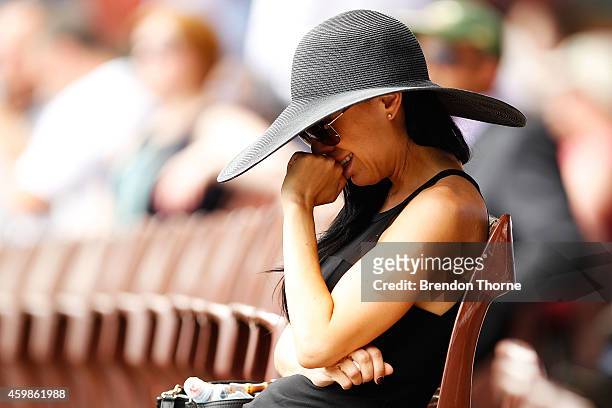 Woman reacts during the funeral service held in Macksville for Australian cricketer Phillip Hughes at the Sydney Cricket Ground on December 3, 2014...