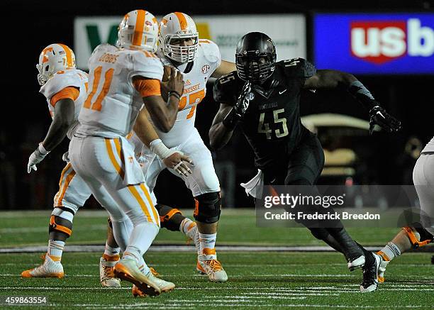 Stephen Weatherly of the Vanderbilt Commodores rushes quarterback Joshua Dobbs of the Tennessee Volunteers at Vanderbilt Stadium on November 29, 2014...