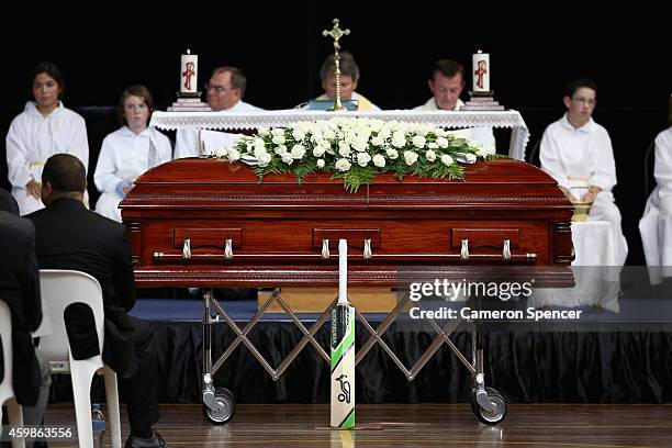 Phillip Hughes's cricket bat rests against his coffin during the Funeral Service for Phillip Hughes at Macksville High School Stadium on December 3,...