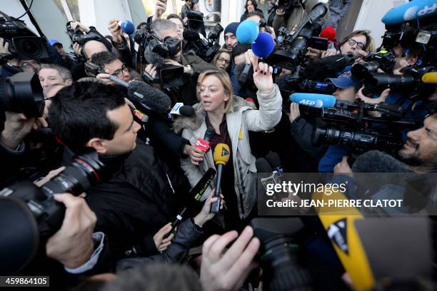 Michael Schumacher's manager, Sabine Kehm, speaks to journalists in front of the Grenoble CHU hospital on January 1st, 2014 where the Formula One...