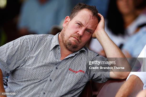 People gather to watch the funeral service held in Macksville for Australian cricketer Phillip Hughes at the Sydney Cricket Ground on December 3,...