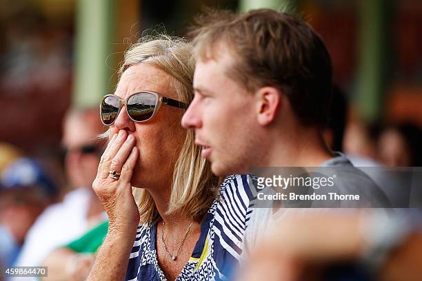 People gather to watch the funeral service held in Macksville for Australian cricketer Phillip Hughes at the Sydney Cricket Ground on December 3,...