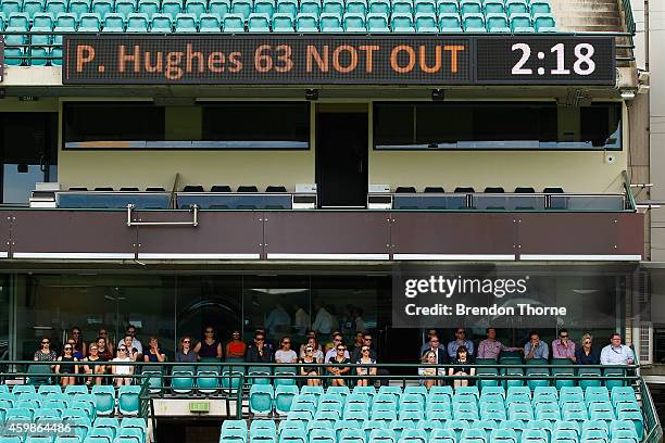 People gather to watch the funeral service held in Macksville for Australian cricketer Phillip Hughes at the Sydney Cricket Ground on December 3,...