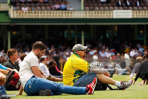 People gather to watch the funeral service held in Macksville for Australian cricketer Phillip Hughes at the Sydney Cricket Ground on December 3,...