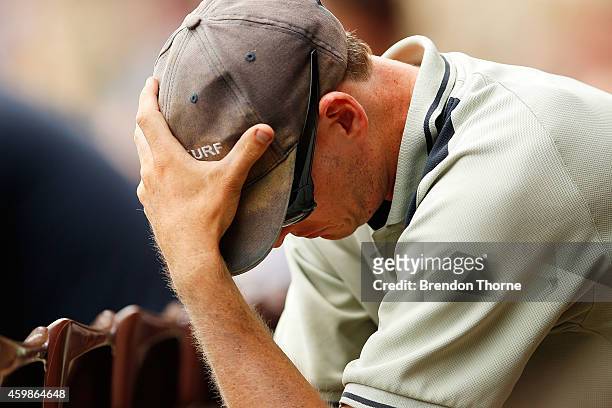 Man reacts during the funeral service held in Macksville for Australian cricketer Phillip Hughes at the Sydney Cricket Ground on December 3, 2014 in...