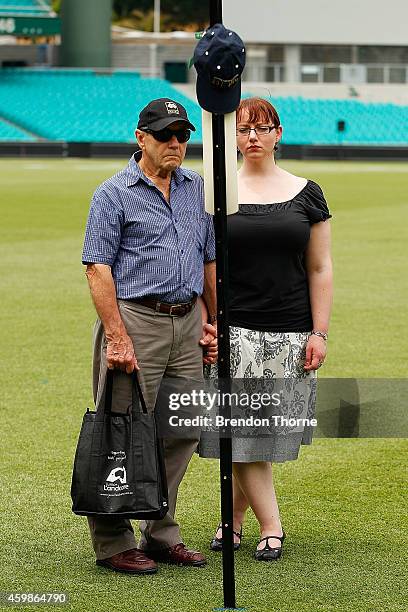 Mourners pay their respects as people gather to watch the funeral service held in Macksville for Australian cricketer Phillip Hughes at the Sydney...