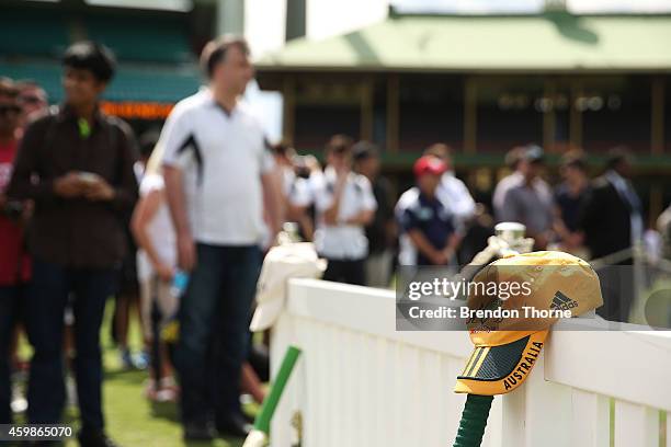 An Australian ODI cap is seen as mourners pay their respects as people gather to watch the funeral service held in Macksville for Australian...